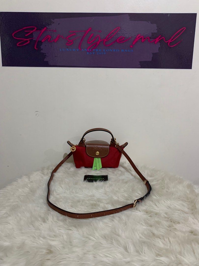 original longchamp mini pouch with sling (Category: Luxury Bags & Wallets) located in Cabuyao City. Submitted by luxbymishy (Listing ID 1245083262, Image 1). Description: authentic brand new complete inclusions .