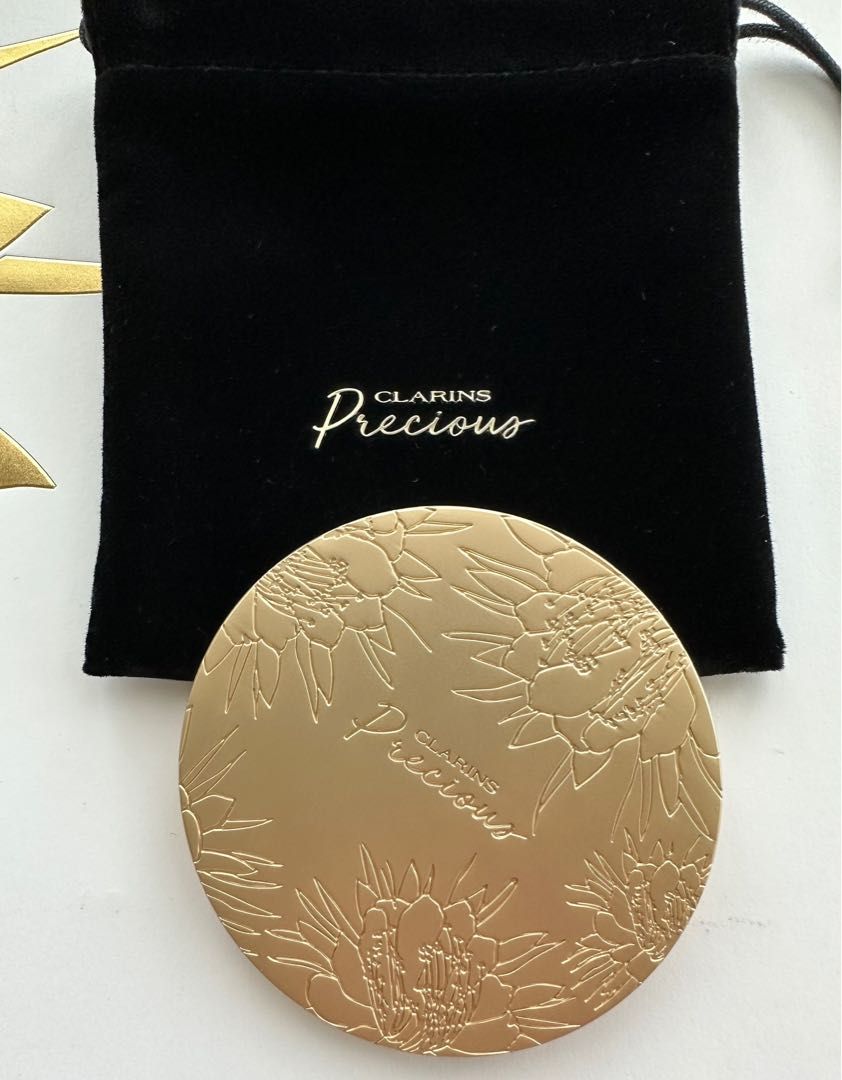 Clarins Precious Pocket Mirror (Category: Accessory holder, box & organizers) located in Singapore. Submitted by shoebidoo (Listing ID 1245326951, Image 3). Description: Clarins Precious Bag/Pocket Mirror 7.5cm diameter. 7mm thickness Matte gold finish. Comes with black velvet pouch as shown. Free tracked mail. No meet up. Payment via PayLah. No Caroupay. .