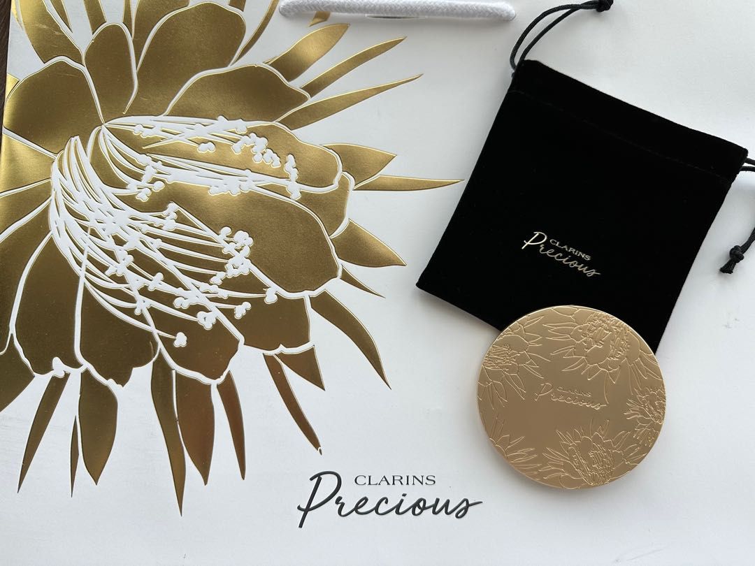 Clarins Precious Pocket Mirror (Category: Accessory holder, box & organizers) located in Singapore. Submitted by shoebidoo (Listing ID 1245326951, Image 1). Description: Clarins Precious Bag/Pocket Mirror 7.5cm diameter. 7mm thickness Matte gold finish. Comes with black velvet pouch as shown. Free tracked mail. No meet up. Payment via PayLah. No Caroupay. .