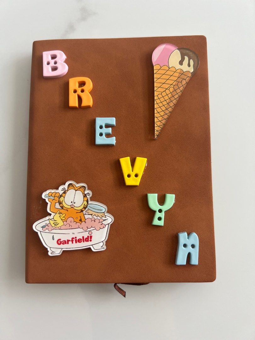 Customised notebook (Category: Stationery & School Supplies) located in Singapore. Submitted by peggylee05 (Listing ID 1245238446, Image 3). Description: Preparing what to get for teacher day present? 1. Choose your notebook colour 2. Choose your charm 3. Do DM us for colour of the notebook, name and charm. A5 : $11.90 B5: $14.90 PS: COLOUR ARE SUBJECTED TO DIFFERENCES DUE TO LIGHTING, Eg. Under the sunlight, under the light and etc..