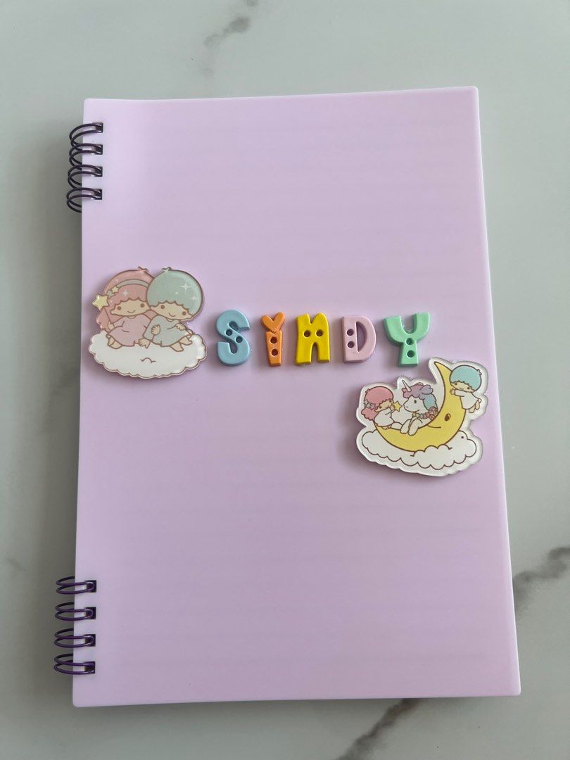 Customised notebook (Category: Stationery & School Supplies) located in Singapore. Submitted by peggylee05 (Listing ID 1245238446, Image 2). Description: Preparing what to get for teacher day present? 1. Choose your notebook colour 2. Choose your charm 3. Do DM us for colour of the notebook, name and charm. A5 : $11.90 B5: $14.90 PS: COLOUR ARE SUBJECTED TO DIFFERENCES DUE TO LIGHTING, Eg. Under the sunlight, under the light and etc..