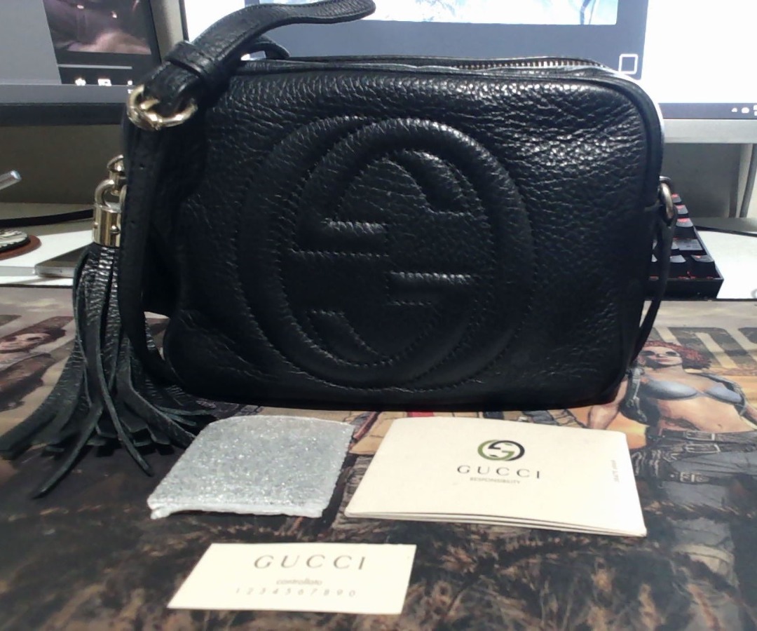 Gucci black purse with tassels discount