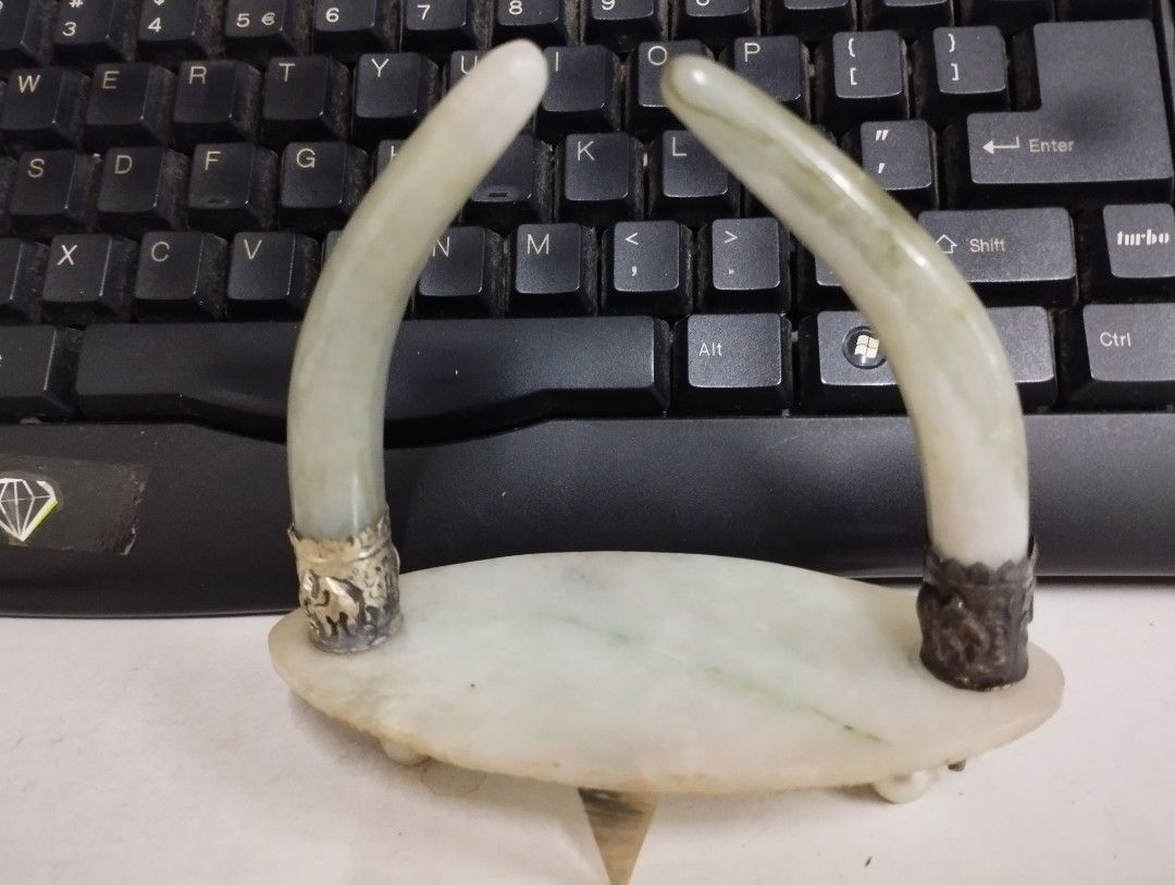 Table Decor (Category: Vintage Collectibles) located in Taiping. Submitted by tlc.pickers (Listing ID 1245274108, Image 1). Description: 11 cm height table decoration of stone tusks. As is condition. Vintage quality..