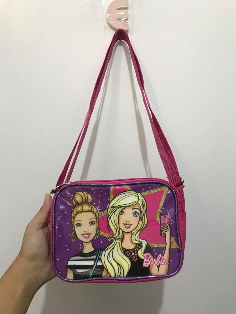 BUNDLE BAG FOR KIDS (Category: Cross-body Bags) located in Santa Rosa. Submitted by _joannealexis (Listing ID 1245717406, Image 3). Description: BARBIE SLING BAG PEPPA PIG LUNCH BAG TAKE ALL ₱500 ‼️ LAST PRICE NA PO 🥹 Barbie bag no issue. Peppa pig lunch bag issue, madumi lang signs of usage and nakatambak na. No shopee checkout ✖️ Courier: JNT 🚚 Lalamove 🚚 📍 STA ROSA LAGUNA.