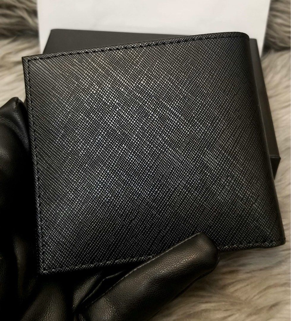 *ONHAND!* Prada Saffiano Leather Men’s Bifold Wallet (Category: Luxury Bags & Wallets) located in Makati City. Submitted by sexytrishy2021 (Listing ID 1245708270, Image 3). Description: *Outlet Item *Bifold Men’s Wallet *Saffiano Leather *Silver Hardware *Comes with Prada Card, Box and Paperbag *No receipt included, supplier does not provide.