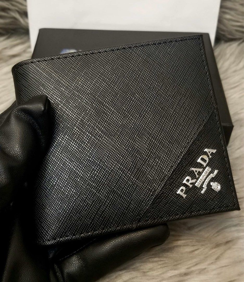 *ONHAND!* Prada Saffiano Leather Men’s Bifold Wallet (Category: Luxury Bags & Wallets) located in Makati City. Submitted by sexytrishy2021 (Listing ID 1245708270, Image 2). Description: *Outlet Item *Bifold Men’s Wallet *Saffiano Leather *Silver Hardware *Comes with Prada Card, Box and Paperbag *No receipt included, supplier does not provide.
