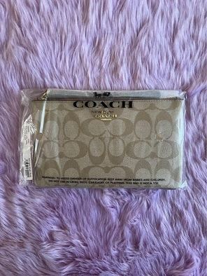 Coach wristlet (Category: Luxury Bags & Wallets) located in Mandaluyong City. Submitted by pheewz07 (Listing ID 1245928113, Image 2). Description: BRAND NEW COACH SIGNATURE WRISTLET PVC LARGE SIZE LIGHT KHAKI - ROSE WITH TAG AND CARECARD NO PAPERBAG PLEASE SEE ACTUAL PHOTOS FOR REFERENCE BOUGHT IN US RFS: decluttering FIXED PRICE - NO HAGGLING.