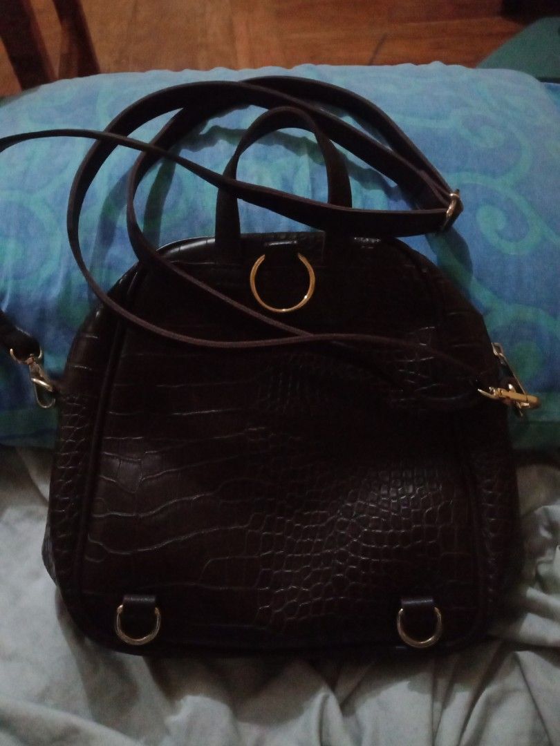 Dark Brown 2 Way Bag (Category: Backpacks) located in Paranaque City. Submitted by _andreaaaa13 (Listing ID 1245952210, Image 3). Description: Secosana 2 Way Bag - Can be used as sling bag or bag pack. Can be used for school and outing. RFS: Already have this kind of bag in other color and also decluttering..