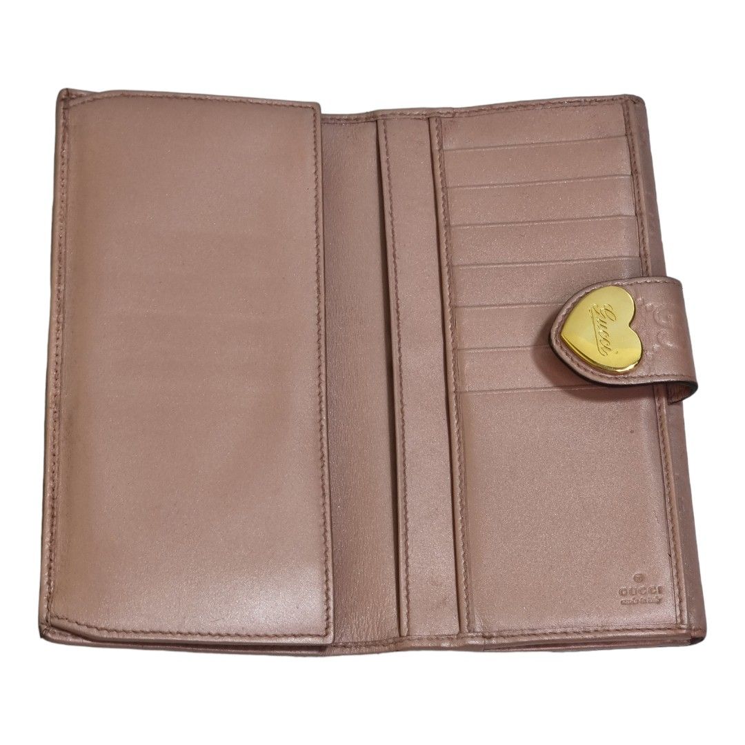 Authentic guccissima Compact wallet (Category: Luxury Bags & Wallets) located in Quezon City. Submitted by manerarestorationservices (Listing ID 1235053195, Image 2). Description: Money back Guarantee 💯% Guaranteed authentic *Brand: G***Issima double sided flap wallet *Materials: monogram calfskin leather *Color: metallic peach *Size: long *Condition: 8/10 color toych up Pls see photos -Used * Inclusions: wallet w/ box 10 : Brand-new or New with