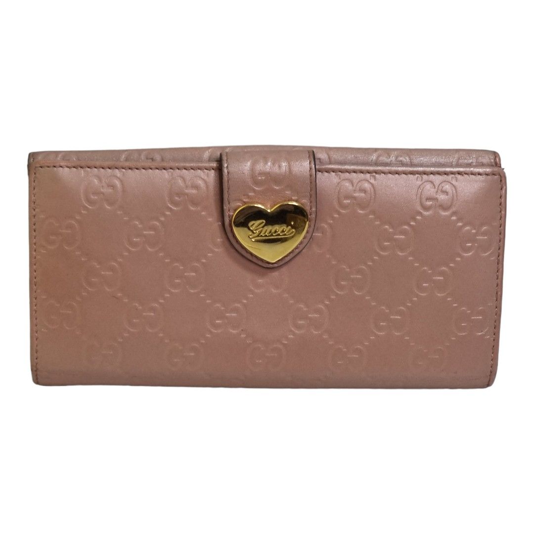 Authentic guccissima Compact wallet (Category: Luxury Bags & Wallets) located in Quezon City. Submitted by manerarestorationservices (Listing ID 1235053195, Image 1). Description: Money back Guarantee 💯% Guaranteed authentic *Brand: G***Issima double sided flap wallet *Materials: monogram calfskin leather *Color: metallic peach *Size: long *Condition: 8/10 color toych up Pls see photos -Used * Inclusions: wallet w/ box 10 : Brand-new or New with