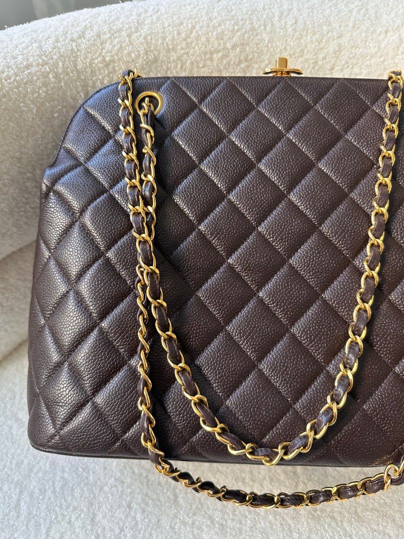 Vintage Chanel kiss lock chain lamb skin shoulder bag. Available
