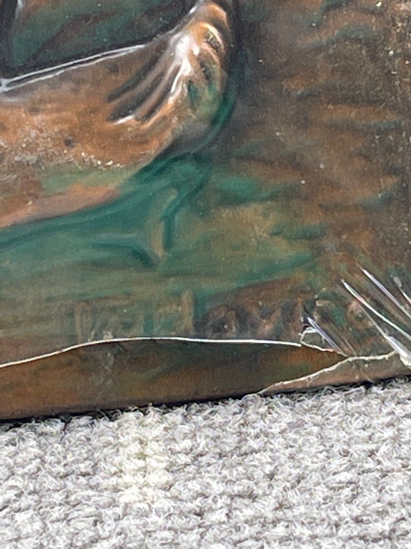 Vintage Copper Artwork Display Embossed copper art design with markings