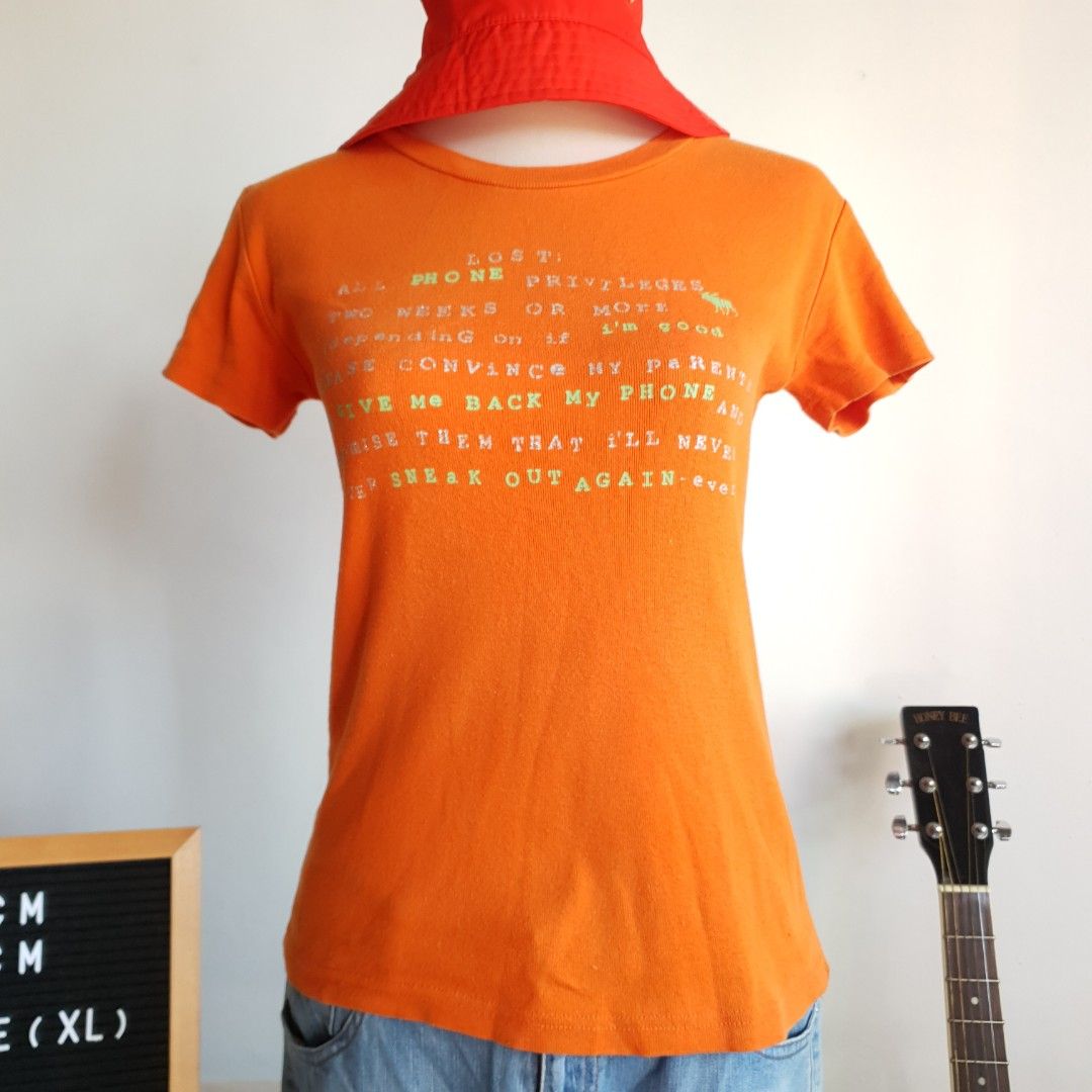 Y2K Tangerine T-shirt (Category: Shirts) located in San Pedro. Submitted by open_stash (Listing ID 1240902868, Image 1). Description: Y2K Tangerine tshirt PHP 75 W 40 cm L 60 cm Tag size: XL.