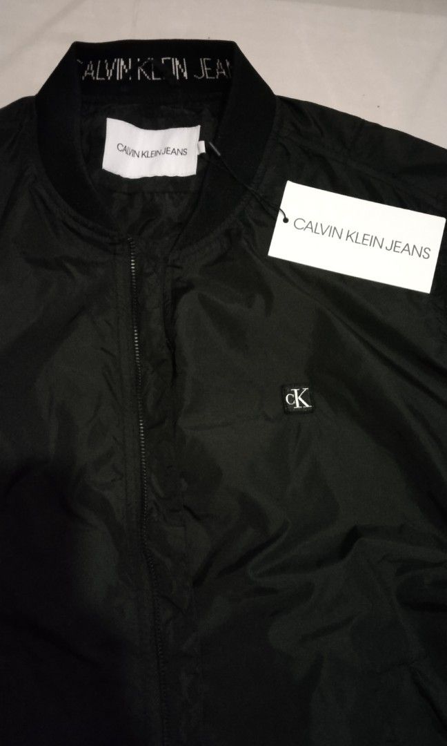 Calvin klein coat shop tag on sleeve
