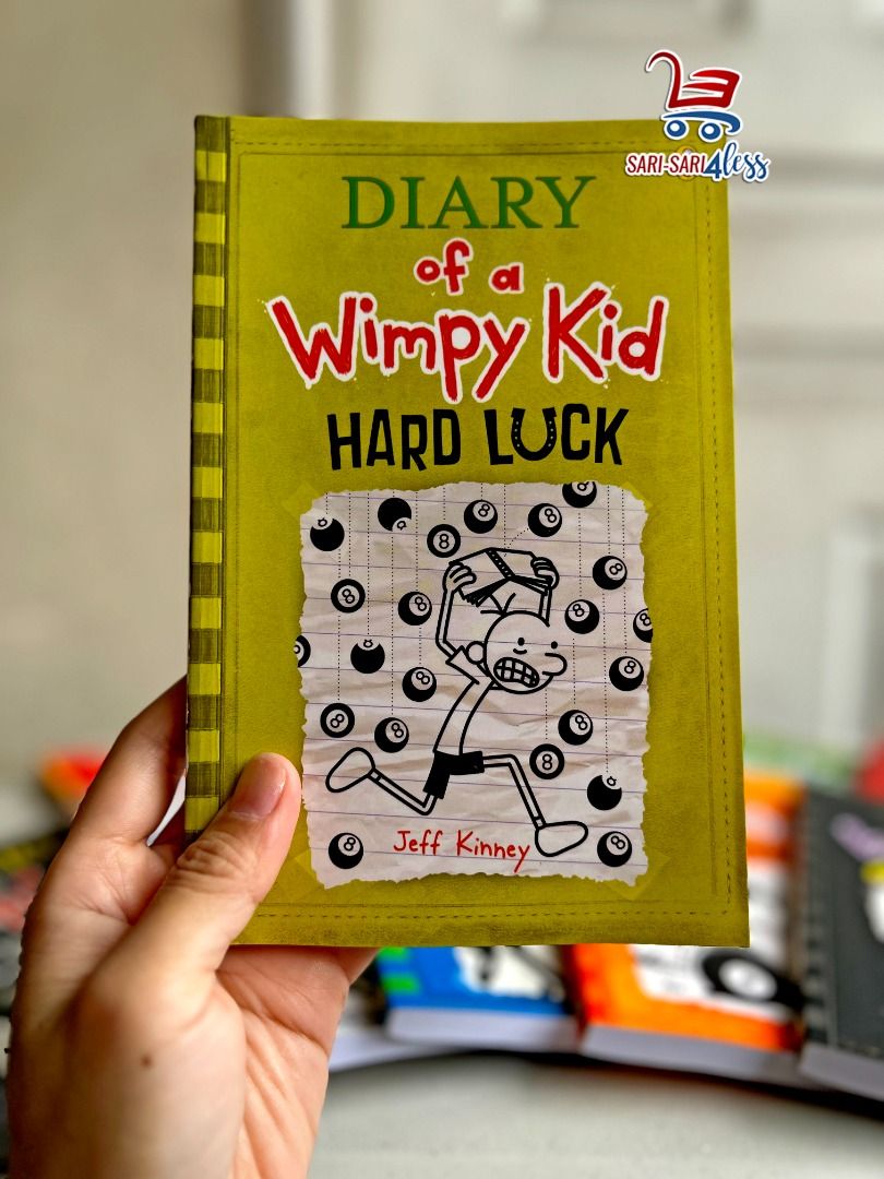 Diary of a Wimpy Kid HARD LUCK (Paperback) (Category: Children's Books) located in Quezon City. Submitted by sarisari4less (Listing ID 1246159909, Image 1). Description: 📚🍀 Diary of a Wimpy Kid: Hard Luck Book for Sale! 🍀📚 Hey, fellow bookworms and Wimpy Kid fans! 📖👋 Looking for a captivating and hilarious read? Your luck just got better! 🎉 📘 Book Title: Diary of a Wimpy Kid: Hard Luck 📕 Author: Jeff Kinney 📢 Description: Embark on a wi