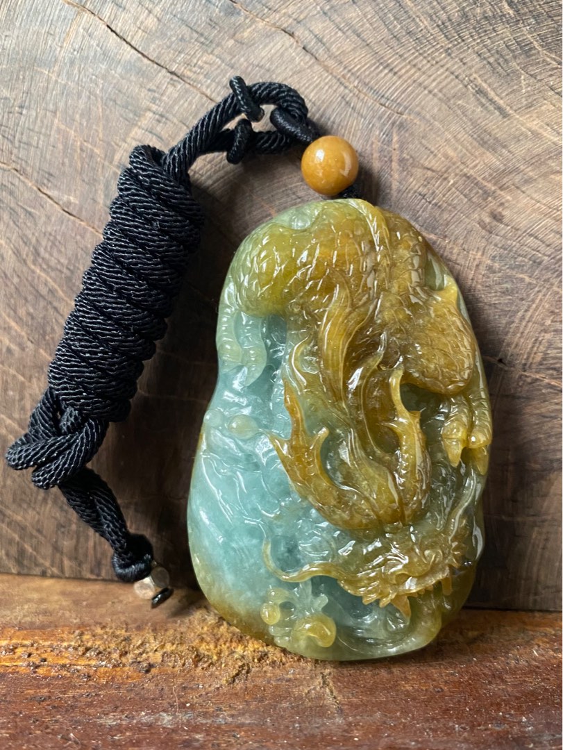 Carved jade top dragon pendant