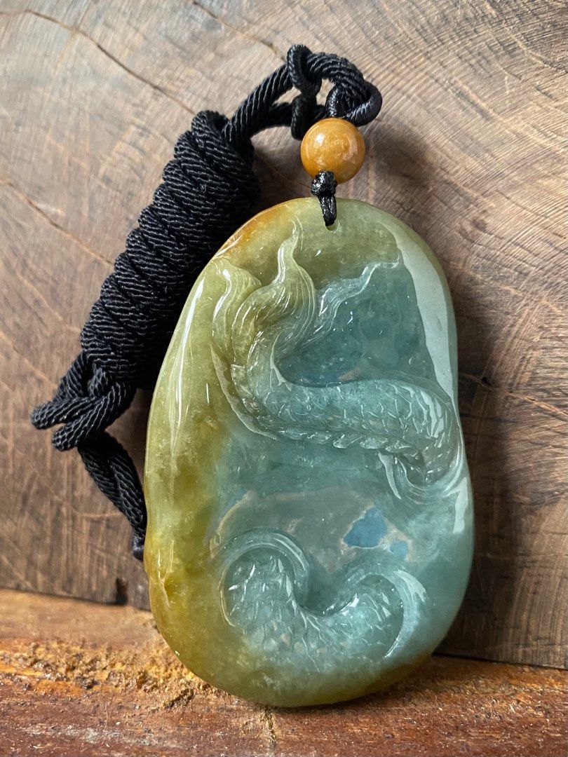 Carved jade dragon pendant best sale
