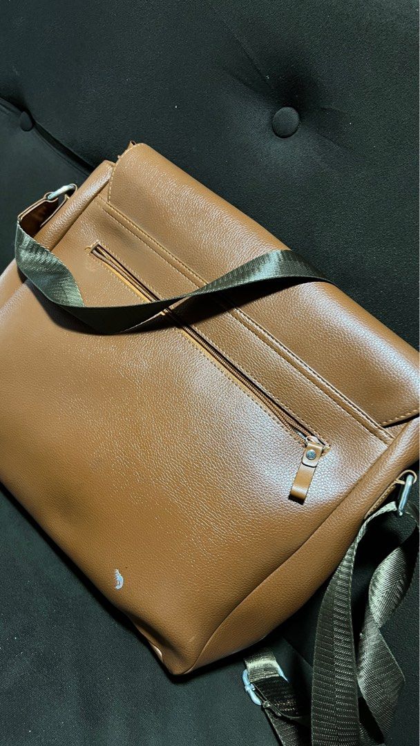 McJim Tan Leather Body Bag (Category: Sling Bags) located in Baliuag. Submitted by guccicarlo (Listing ID 1246042888, Image 2). Description: Very much in good condition Tan Genuine Leather With very minor paint stain (I think can be removed) RFS: To buy new bag.