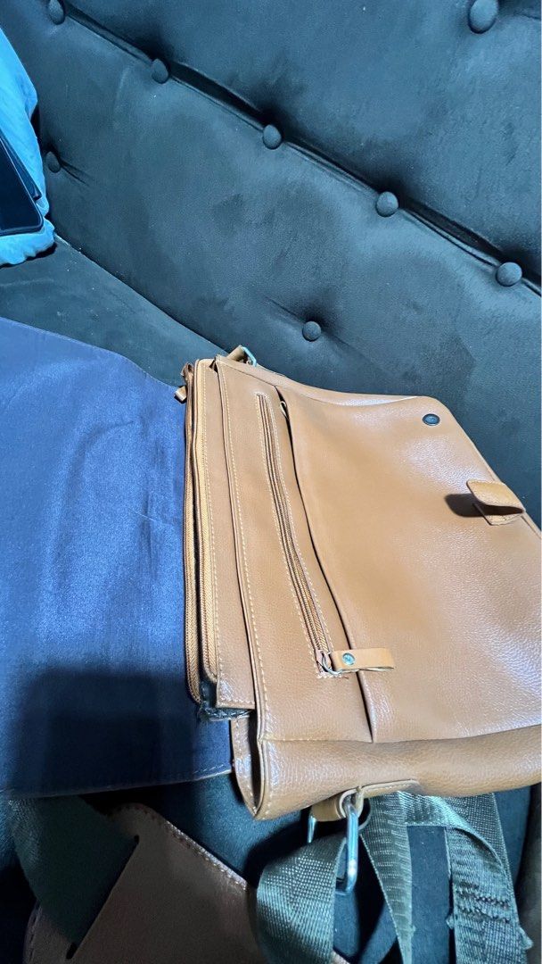 McJim Tan Leather Body Bag (Category: Sling Bags) located in Baliuag. Submitted by guccicarlo (Listing ID 1246042888, Image 3). Description: Very much in good condition Tan Genuine Leather With very minor paint stain (I think can be removed) RFS: To buy new bag.