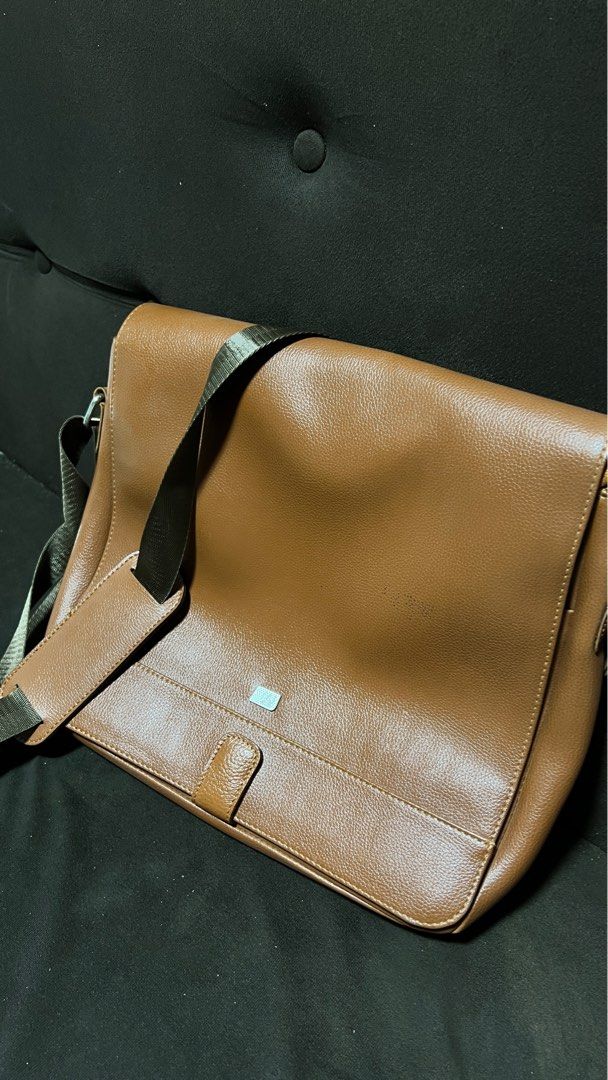 McJim Tan Leather Body Bag (Category: Sling Bags) located in Baliuag. Submitted by guccicarlo (Listing ID 1246042888, Image 1). Description: Very much in good condition Tan Genuine Leather With very minor paint stain (I think can be removed) RFS: To buy new bag.
