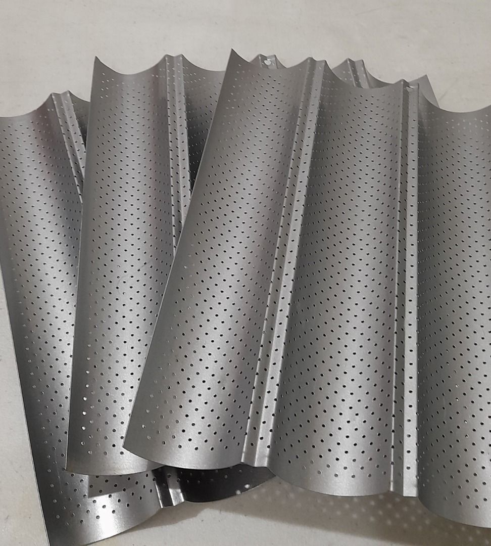 Walfos Baguette/Bread Mold Pan (Category: Bakeware) located in Quezon City. Submitted by yanadoodles25 (Listing ID 1246156828, Image 1). Description: -bought from Laz*** for P700+ each -food grade carbon steel, 4 groove -barely used pans although with scratch markings, no bent -size of pan is 13x15 inches -available quantity: 2 pcs left.