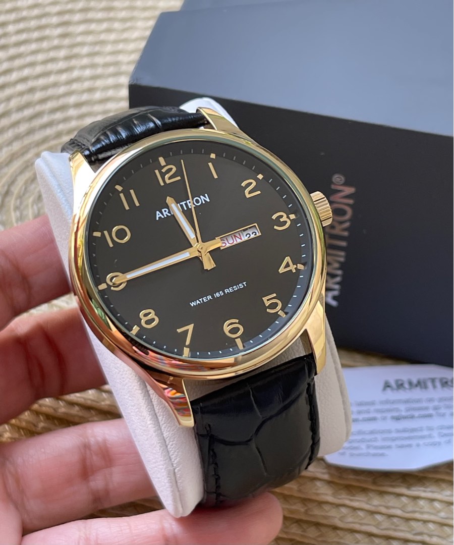 Armitron black and gold watch store