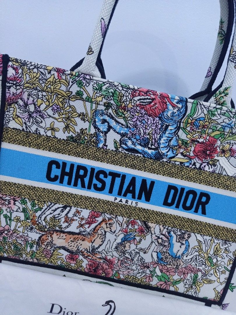 Japan Preloved CD booktote (Category: Luxury Bags & Wallets) located in Cebu City. Submitted by day.98 (Listing ID 1246349571, Image 2). Description: selected from japan surplus fully embroidered coded meduim size with dust bag no flaws.