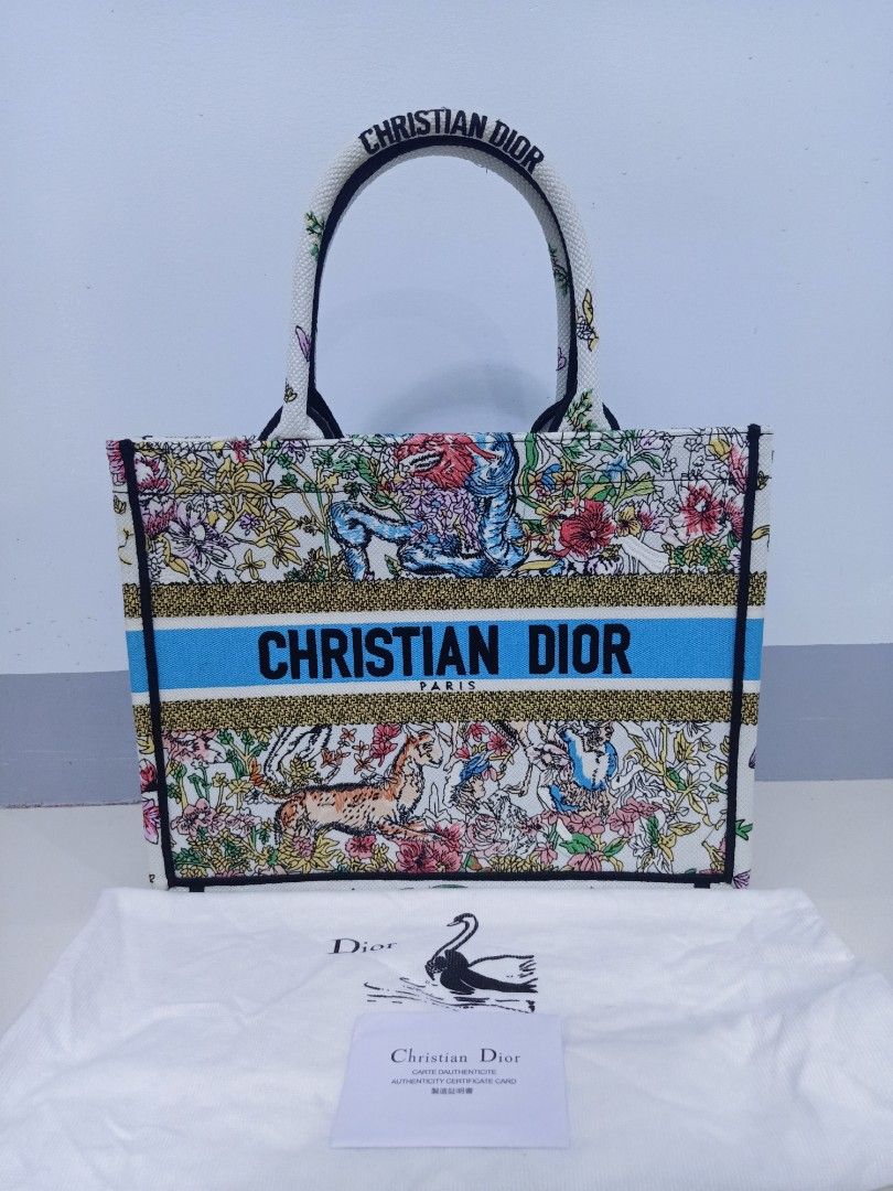 Japan Preloved CD booktote (Category: Luxury Bags & Wallets) located in Cebu City. Submitted by day.98 (Listing ID 1246349571, Image 1). Description: selected from japan surplus fully embroidered coded meduim size with dust bag no flaws.