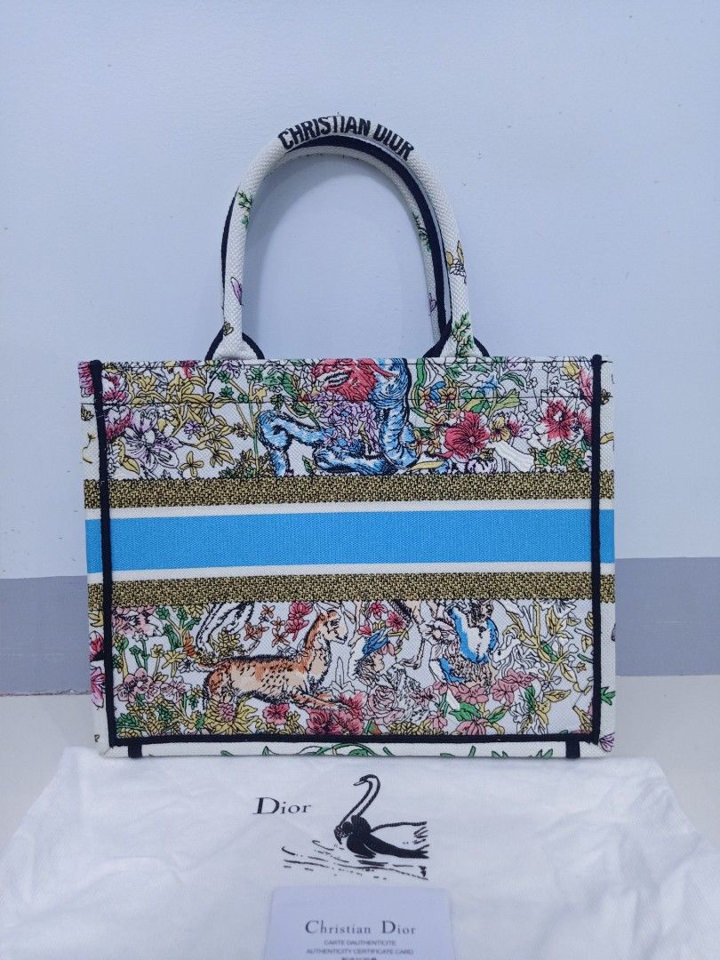 Japan Preloved CD booktote (Category: Luxury Bags & Wallets) located in Cebu City. Submitted by day.98 (Listing ID 1246349571, Image 3). Description: selected from japan surplus fully embroidered coded meduim size with dust bag no flaws.