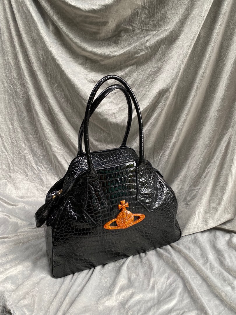 The croc-embossed Josephine bag comes - Vivienne Westwood