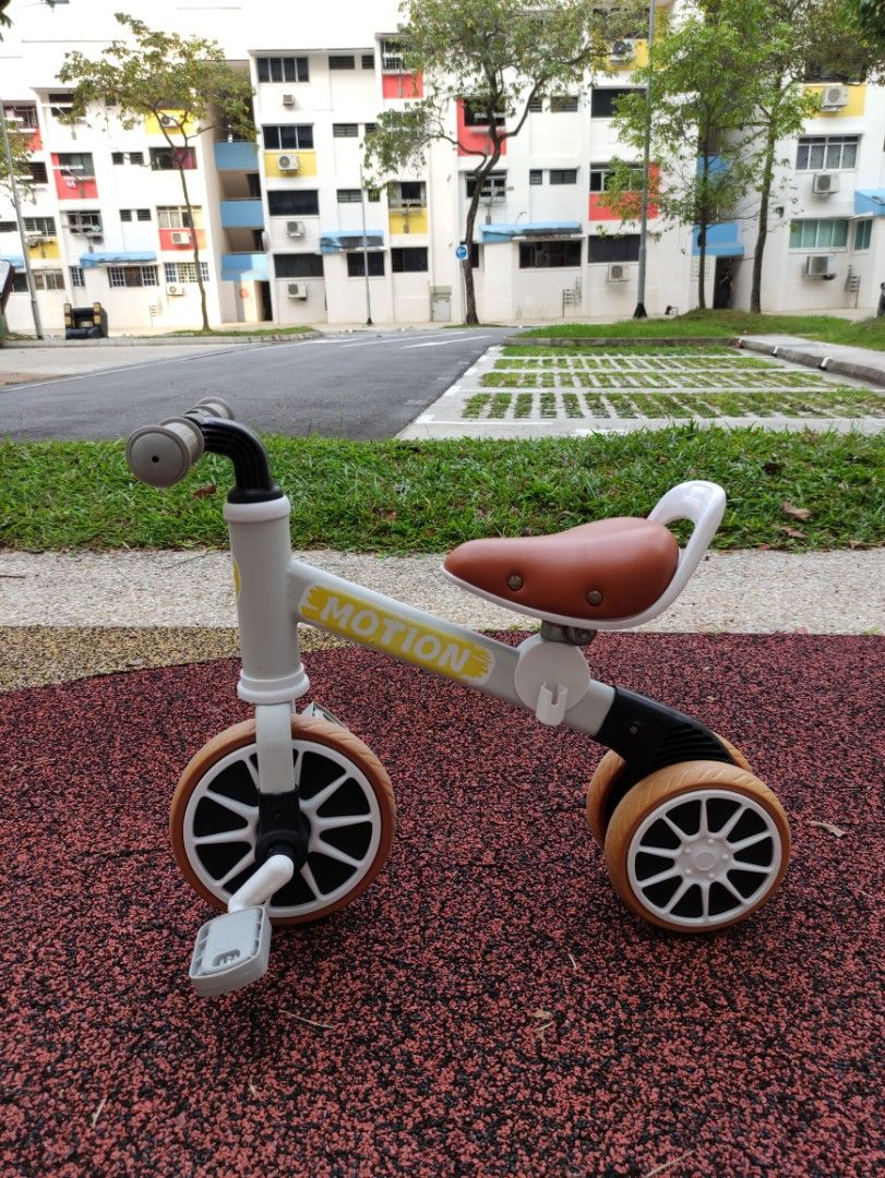 Strider tricycle top