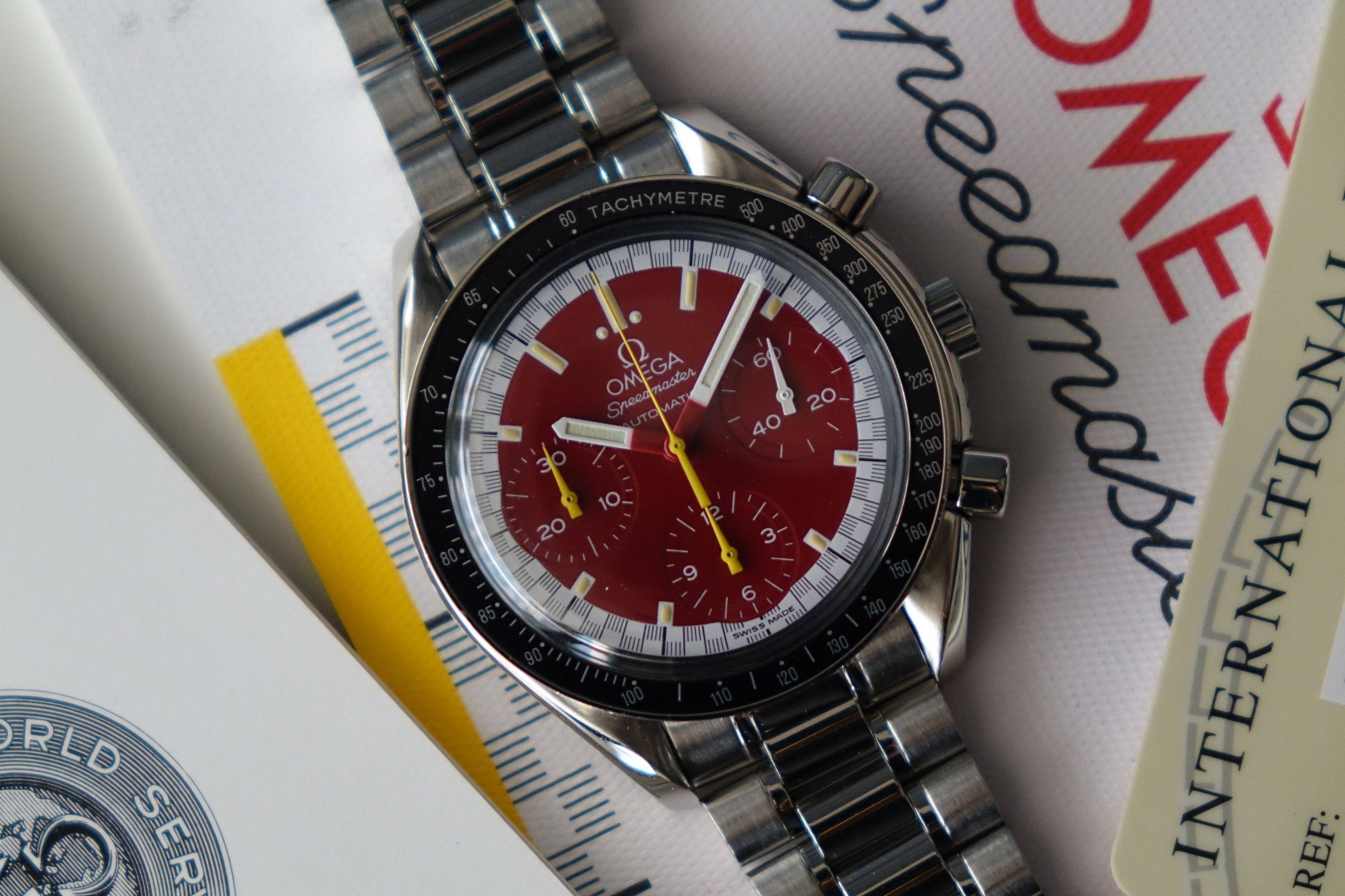 Omega speedmaster michael schumacher red sales