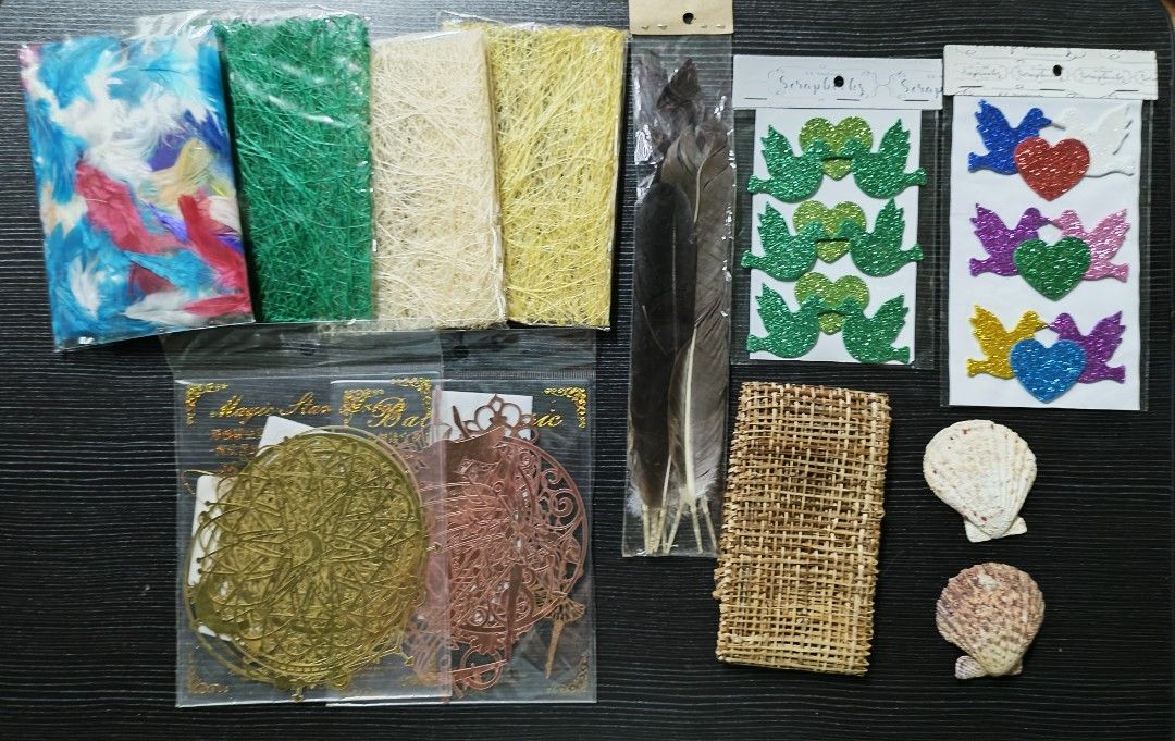 Scrapbooking materials (Category: Craft Supplies & Tools) located in Makati City. Submitted by mybentables (Listing ID 1194050859, Image 1). Description: All onhand and in good condition Feathers were initially used and was removed frm initial project to be re-used (so some parts have dried glue and paper stuck to it -- kindly see pic provided) See additional pics for better details.