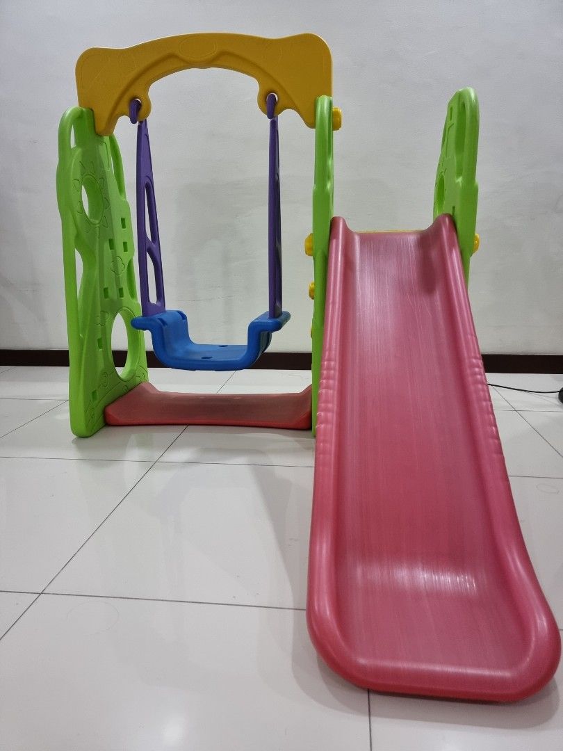 Slide with swing (Category: Infant Playtime) located in Quezon City. Submitted by lamquel (Listing ID 1246321924, Image 1). Description: Swing with slide.