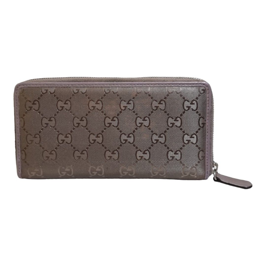 Authentic GUCCISSIMA Zippy Wallet (Category: Luxury Bags & Wallets) located in Quezon City. Submitted by manerarestorationservices (Listing ID 1238886298, Image 1). Description: Money back Guarantee 💯% Guaranteed authentic *Brand: GUCCISSIMA ZIPPY *Materials: monogram leather *Color: metalic lightpurple *Size: long *Condition: well used NOTE: Change Puller, touch up lips leather lining / " halatang second hand. " -Used * Inclusions: 8/10 wallet 