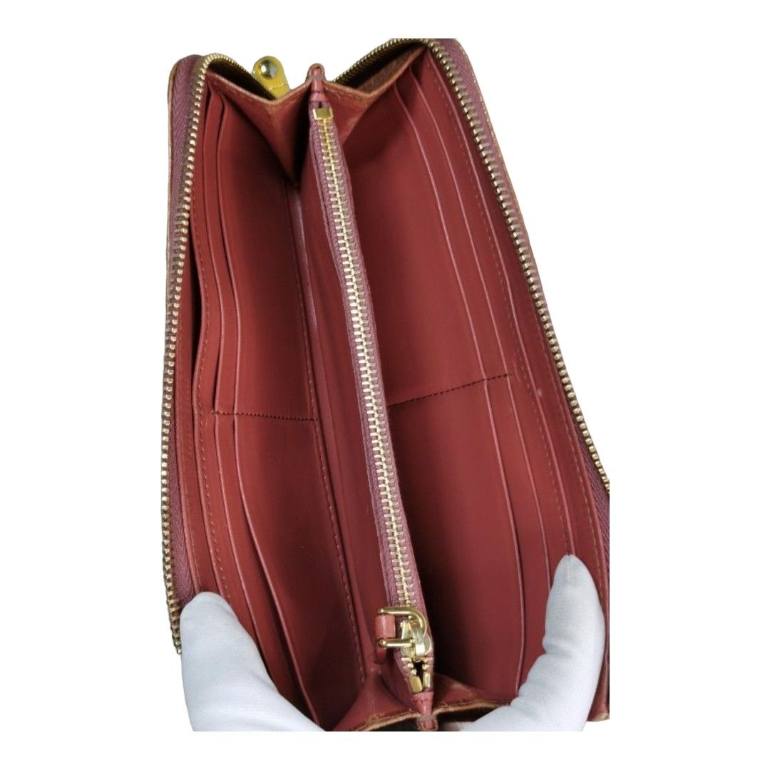 authentic miu miu slim zippy wallet (Category: Luxury Bags & Wallets) located in Quezon City. Submitted by manerarestorationservices (Listing ID 1208566348, Image 2). Description: SALE SALE SALE❗❗❗ Money back Guarantee 💯% Gauranteed authentic MIUMIU Slim zippy wallet *Color: brown orange croc skin *Size: long slim *Condition: 8/10 never been spa -Used * Inclusions: wallet only Rank review by the criterion of our shop about the products condition