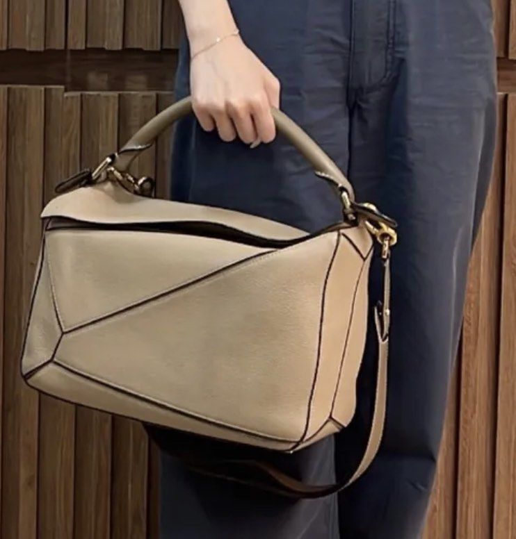 Loewe Puzzle Medium Sand (Category: Luxury Bags & Wallets) located in Quezon City. Submitted by __12345 (Listing ID 1241017969, Image 1). Description: - ONHAND & ready for delivery/meet ups - 9/10 condition - inclusions: dustbag - guaranteed authentic or money back - detailed photos available upon request - entrupy available upon request open to other bag requests! just send a pm 💌🛍️.
