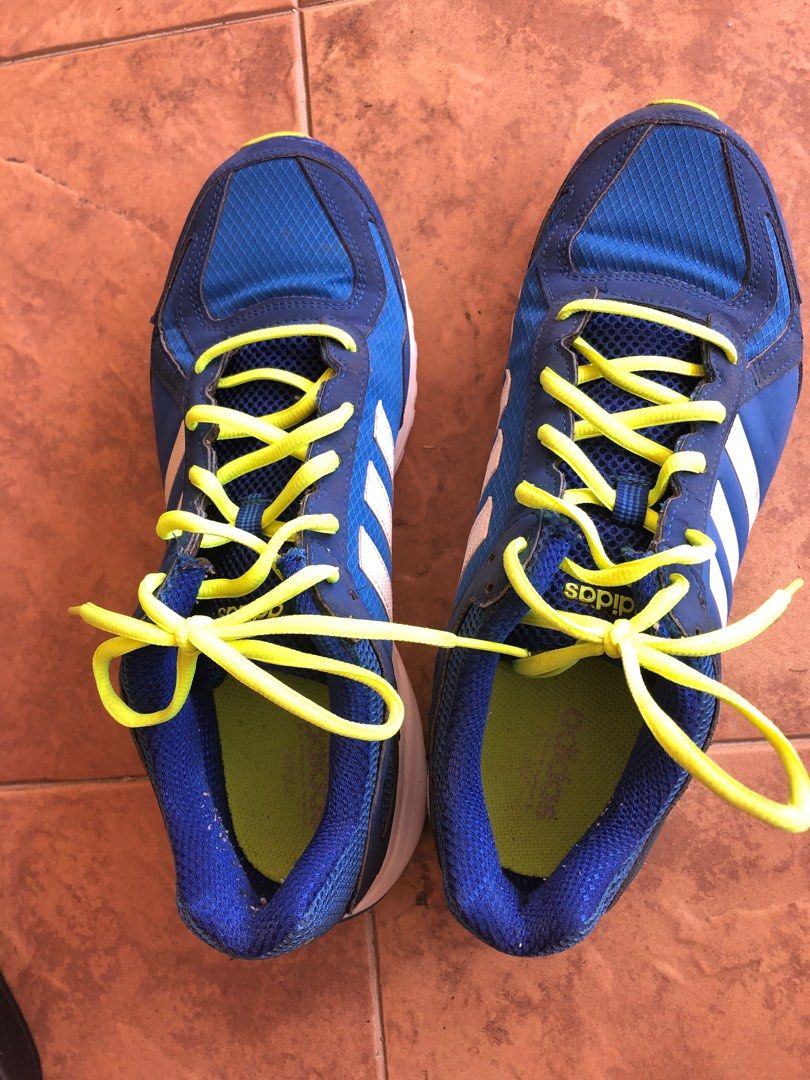 Blue and yellow adidas running shoes 2025