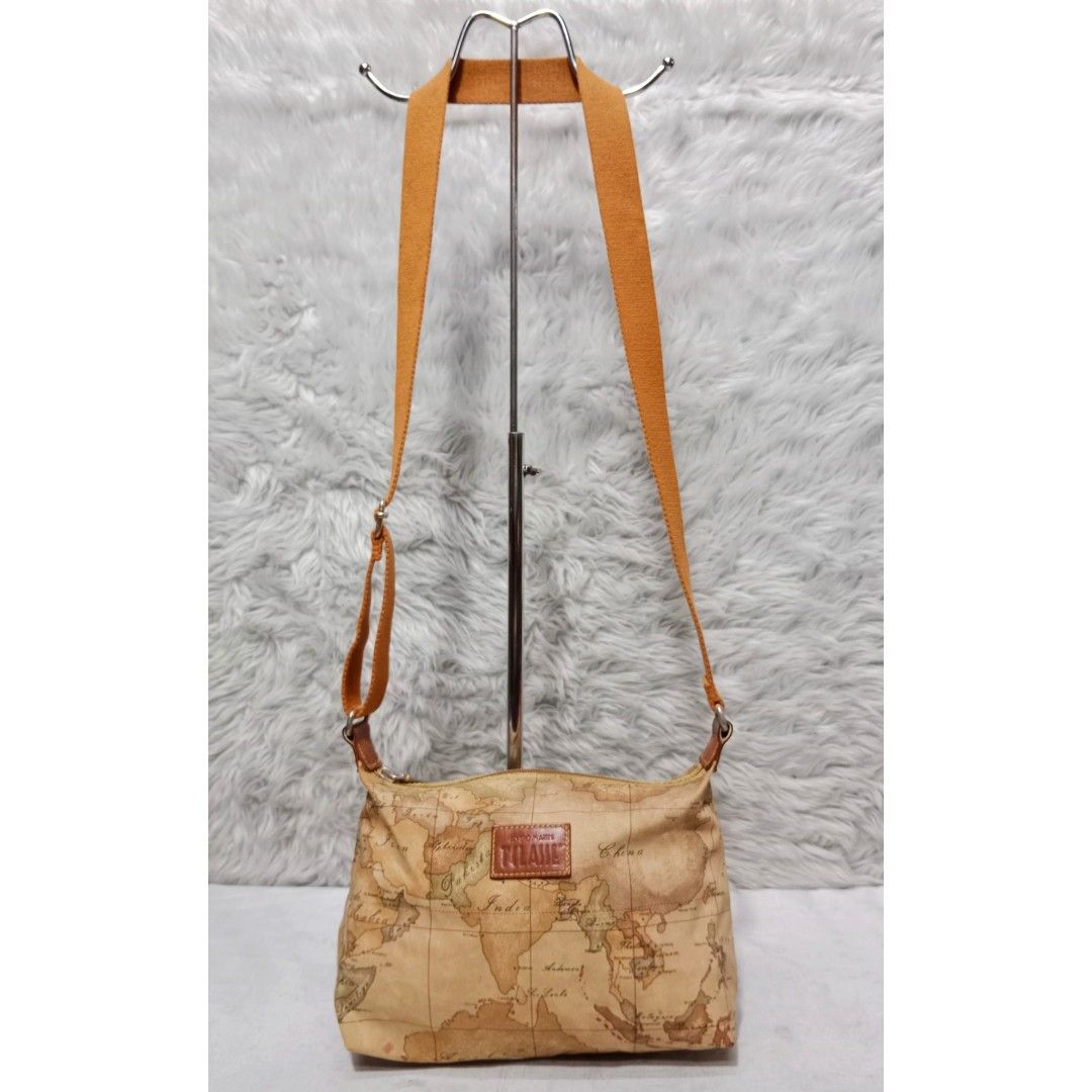 Authentic Alviero Martini Fabric Sling Bag (Category: Luxury Bags & Wallets) located in Caloocan City. Submitted by sassypurchased (Listing ID 1241254059, Image 1). Description: Authentic Alviero Martini Fabric Sling Bag 2,499 FIXED PRICE Good condition, with usual sign of usage, minimal Adjustable strap From Japan Preloved Shop NOT UKAY SOURCE NO HAGGLING PLS H-8 L-11 W-2.5 inches approx Handle Drop: 19.5 inches approx DETAILS ARE POSTED IN THE 