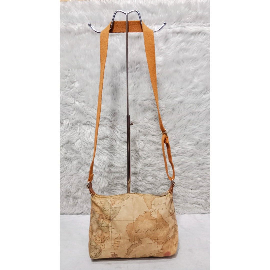 Authentic Alviero Martini Fabric Sling Bag (Category: Luxury Bags & Wallets) located in Caloocan City. Submitted by sassypurchased (Listing ID 1241254059, Image 3). Description: Authentic Alviero Martini Fabric Sling Bag 2,499 FIXED PRICE Good condition, with usual sign of usage, minimal Adjustable strap From Japan Preloved Shop NOT UKAY SOURCE NO HAGGLING PLS H-8 L-11 W-2.5 inches approx Handle Drop: 19.5 inches approx DETAILS ARE POSTED IN THE 