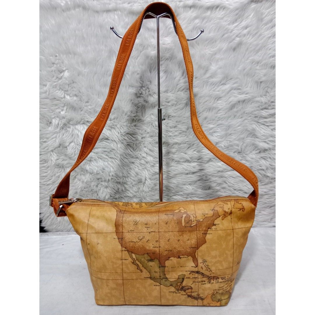 Authentic Alviero Martini Sling Bag/Shoulder Bag (Category: Cross-body Bags) located in Caloocan City. Submitted by sassypurchased (Listing ID 1241270941, Image 1). Description: Authentic Alviero Martini Sling Bag/ Shoulder Bag 1,999 FIXED PRICE Pls see all photos for condition and flaws From Japan Preloved Shop NOT UKAY SOURCE NO HAGGLING PLS H-8.5 L-15.5 W-6.5 inches approx Handle Drop: 20 inches approx DETAILS ARE POSTED IN THE PIC ♥️Sold as i
