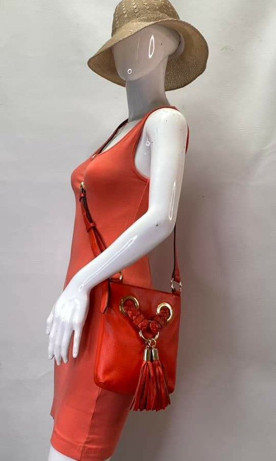 Authentic Michael Kors red orange sling crossbody bag (Category: Luxury Bags & Wallets) located in San Pablo. Submitted by jess_tw_carpena (Listing ID 1241366111, Image 2). Description: mint condition (almost new) with dustbag personal ratings: 9/10.