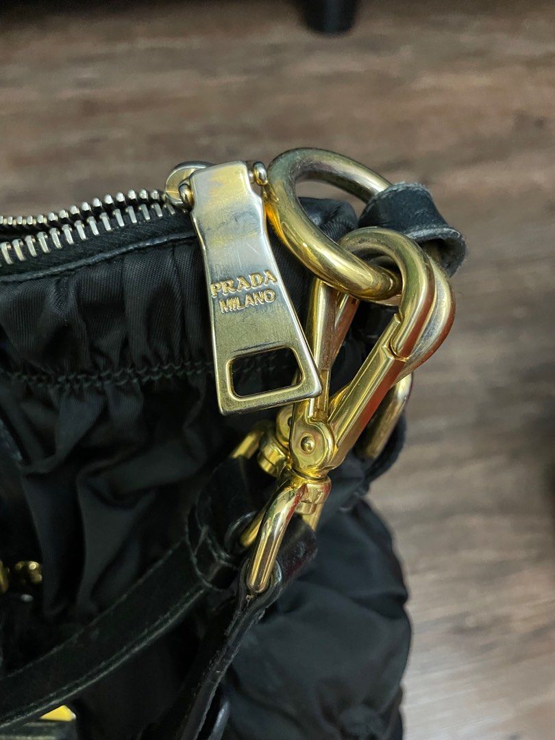 Gold top prada bag