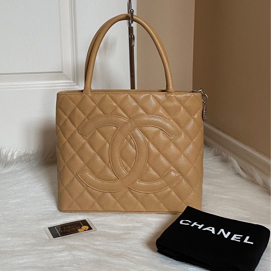 Authentic Preloved Chanel Caviar Medallion Tote in Beige with Silver  Hardware, Luxury, Bags & Wallets on Carousell