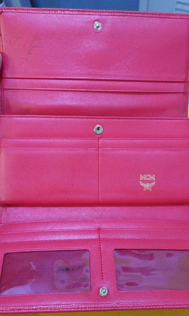 Original MCM Long Wallet (Category: Luxury Bags & Wallets) located in Quezon City. Submitted by waemierrie (Listing ID 1241530779, Image 3). Description: Original MCM wallet selling this low due to flaws: fades on the edges (needs recolor) and hardwares are faded. the inside has pen marks but it (the inside) is overall clean and smooth pa..