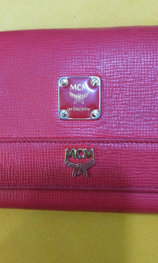 Original MCM Long Wallet (Category: Luxury Bags & Wallets) located in Quezon City. Submitted by waemierrie (Listing ID 1241530779, Image 2). Description: Original MCM wallet selling this low due to flaws: fades on the edges (needs recolor) and hardwares are faded. the inside has pen marks but it (the inside) is overall clean and smooth pa..