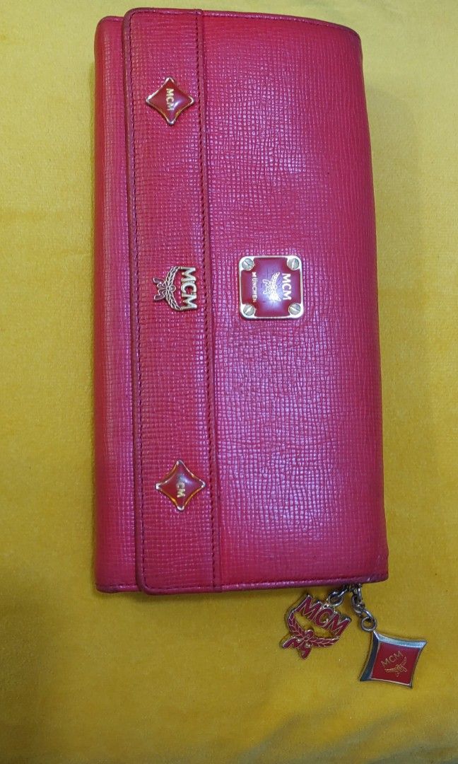 Original MCM Long Wallet (Category: Luxury Bags & Wallets) located in Quezon City. Submitted by waemierrie (Listing ID 1241530779, Image 1). Description: Original MCM wallet selling this low due to flaws: fades on the edges (needs recolor) and hardwares are faded. the inside has pen marks but it (the inside) is overall clean and smooth pa..
