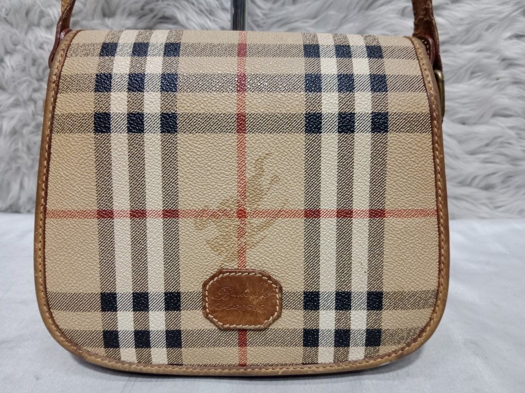Authentic Burberry Plaid Crossbody Bag (Category: Luxury Bags & Wallets) located in Caloocan City. Submitted by sassypurchased (Listing ID 1241591216, Image 3). Description: Authentic Burberry Plaid Crossbody Bag 3,499 Pigtas na po ang isang part ng sling. With Certificate of Assessment From Japan Preloved Shop NOT UKAY SOURCE NO HAGGLING PLS H-6.5 L-7.5 W-2.5 inches approx Handle Drop: 21.5 inches approx DETAILS ARE POSTED IN THE PIC ♥️Sold as i