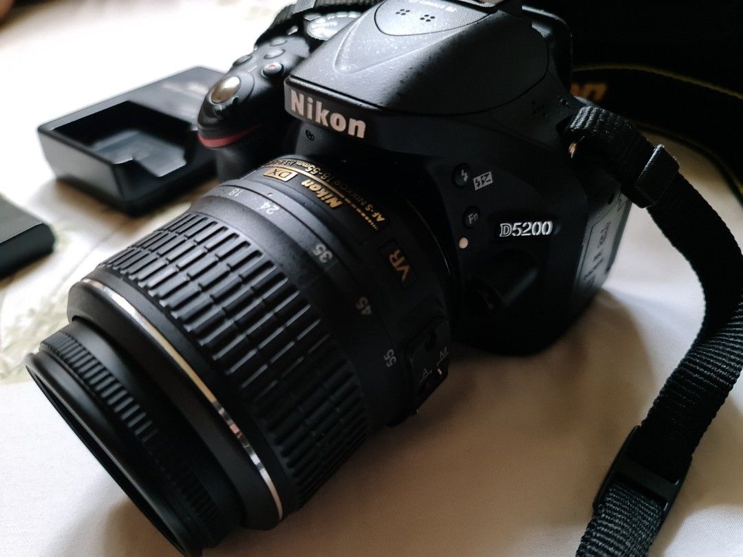 Nikon D5200 (Category: Cameras) located in Quezon City. Submitted by stuffshedder (Listing ID 1241654908, Image 2). Description: inclusions: Camera Bag Original Nikon Camera Strap 18-55mm Lens Original Nikon Battery and Charger no camera lens cap no sd card Issue: shutter button error sometimes appears. No issue with the lens or pictures taken. Name your price - not sure how much this would sell. Bag is Ruggard: check price online. .