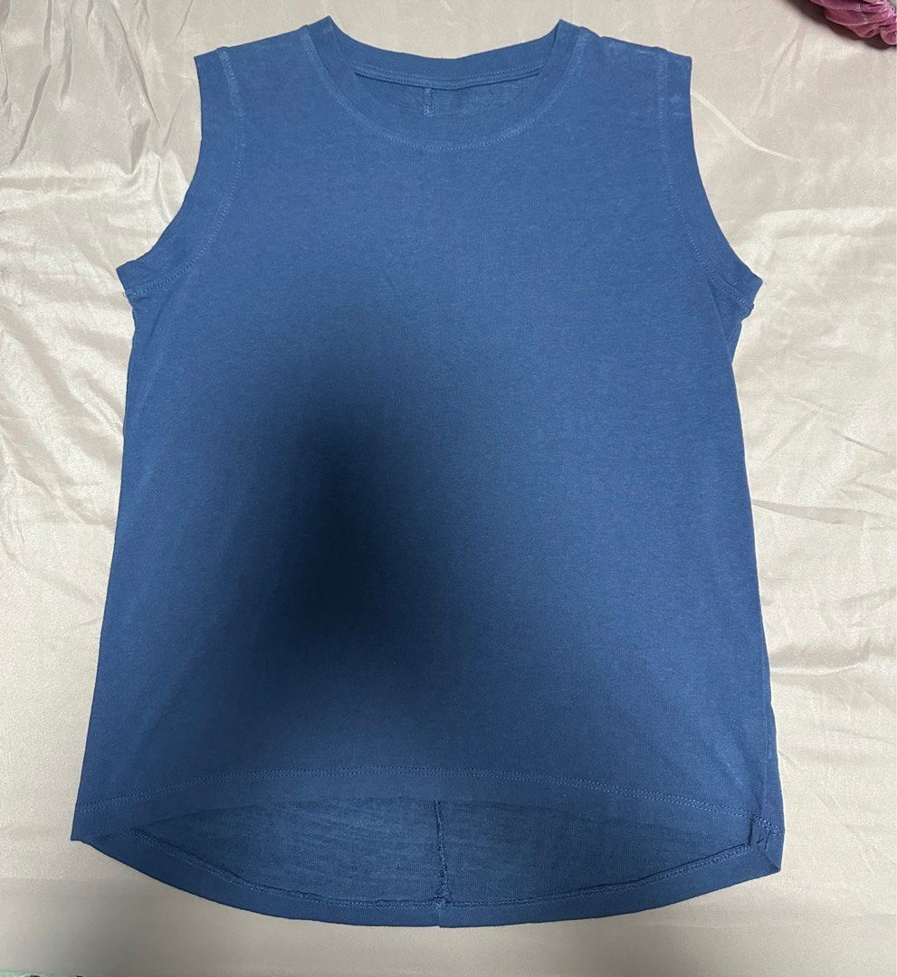 Basic Solid Blue Tank Top (Category: Sleeveless) located in Singapore. Submitted by celine.lhs (Listing ID 1241933493, Image 2). Description: Size: free size can fit S/M Material: thing cotton, suitable for hot weather Condition: 10/10, worn once only.